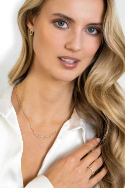ZINZI gold plated zilveren oorstekers (13mm) met een open ovale vorm bezet met witte zirconia's ZIO2398Y