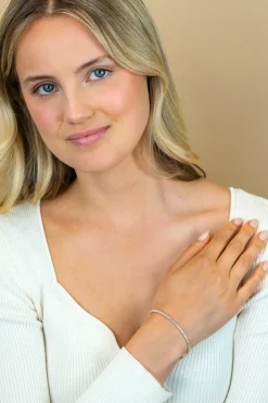 ZINZI gold plated zilveren tennis armband 2,5mm breed en bezet met witte zirconia's in ronde kastzettingen 17-20cm ZIA2590Y